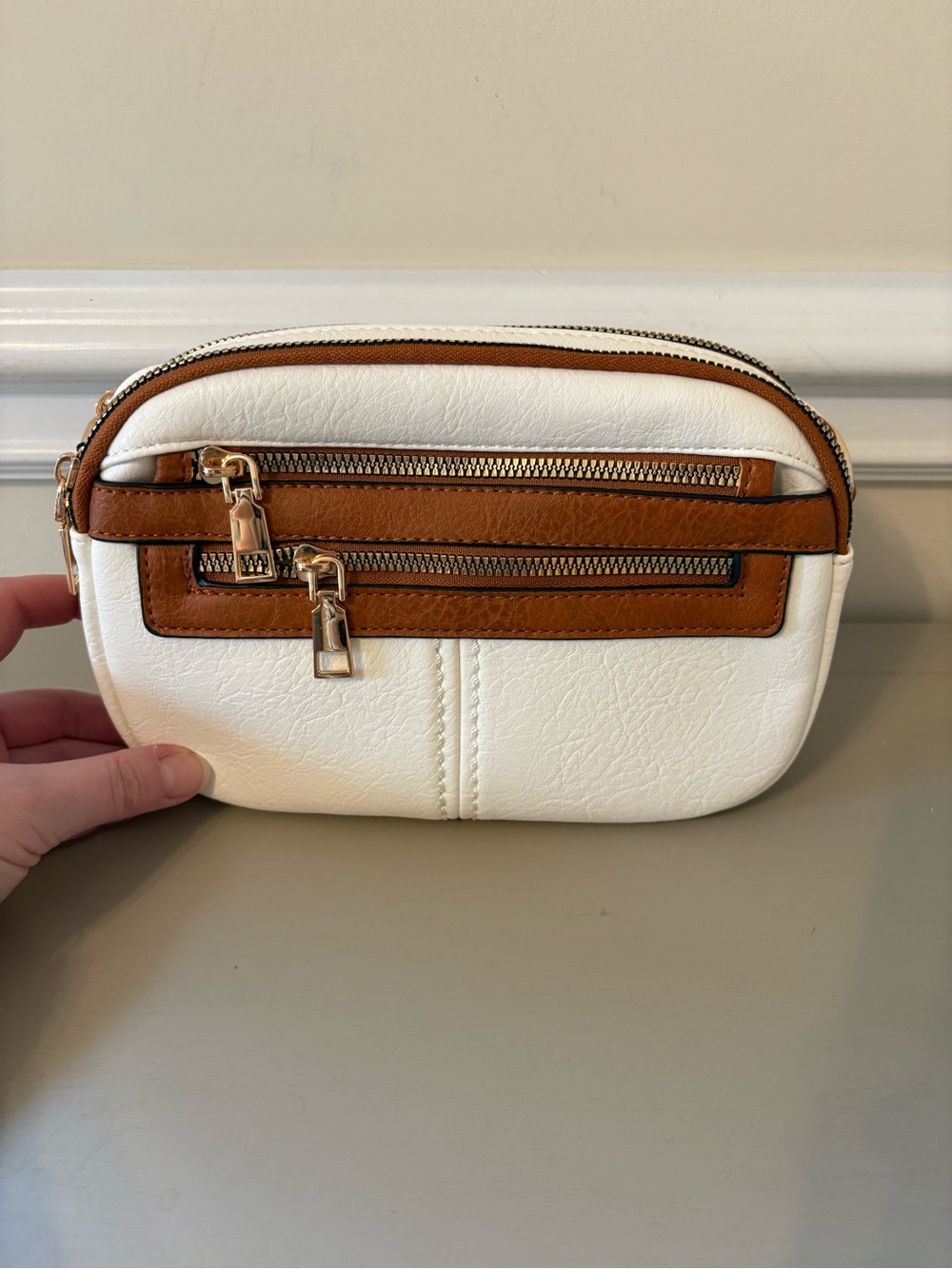 White and Tan Zip-Front Crossbody Pouch with Gold Hardware